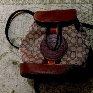 Coach back pack hand bag. With orange stripe